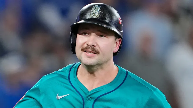 Cal Raleigh #29 of the Seattle Mariners tosses his bat after hitting a solo home run.