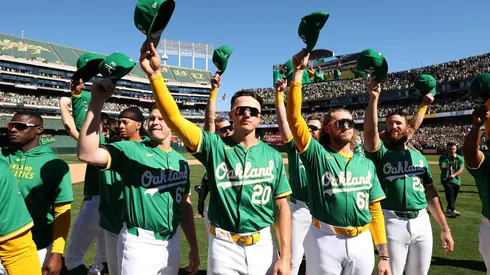 Zack Gelof #20 of the Oakland Athletics and teammates wave to the crowd in 2024.