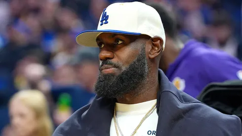Lebron James #23 of the Los Angeles Lakers looks on from the bench.