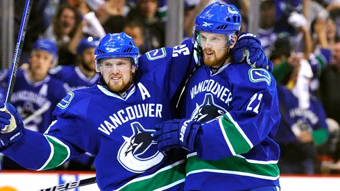 Daniel Sedin #22 and Henrik Sedin #33 of the Vancouver Canucks in 2010.