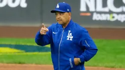 Manager Dave Roberts of the Los Angeles Dodgers walks across the field.