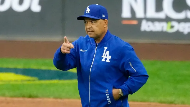 Manager Dave Roberts of the Los Angeles Dodgers walks across the field.