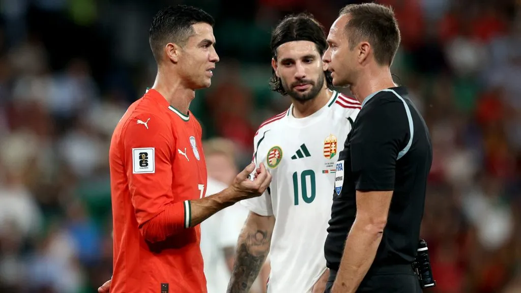 Cristiano Ronaldo and Dominik Szoboszlai speak to the referee. (Carlos Rodrigues/Getty Images)