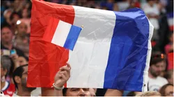 Fans wave a flag of France
