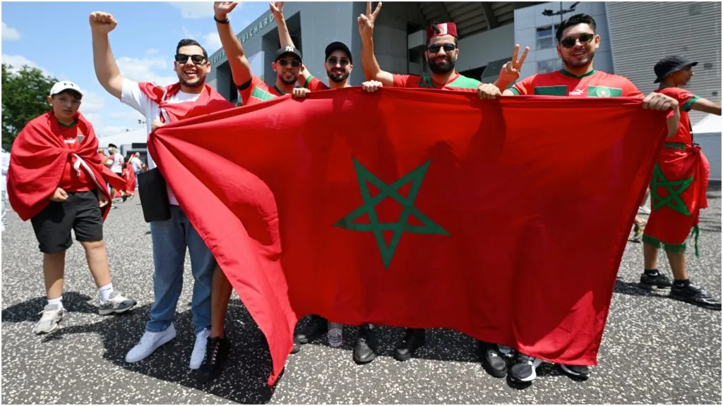 Fans of Morocco pose with the flag – Tullio M. Puglia/Getty Images