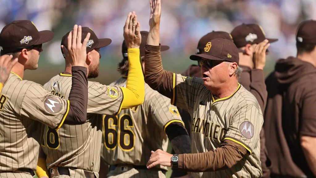 Manager Mike Shildt #8 of the San Diego Padres high fives players during pregame introductions. (Photo by Michael Reaves/Getty Images)