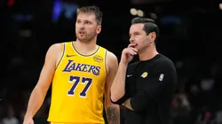 Luka Doncic #77 of the Los Angeles Lakers talks with head coach JJ Redick.