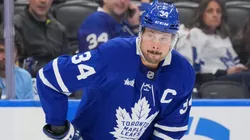 Auston Matthews #34 of the Toronto Maple Leafs controls the puck.