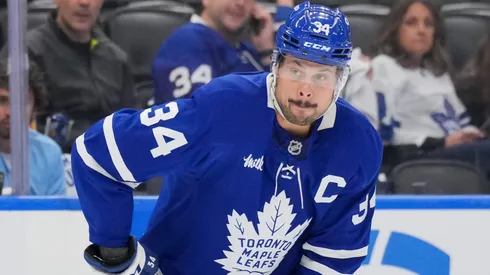 Auston Matthews #34 of the Toronto Maple Leafs controls the puck.