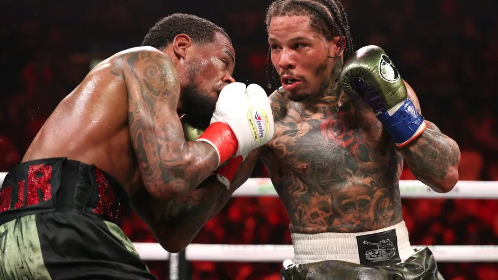 Gervonta Davis punches Lamont Roach Jr. during their bout for Davis’ WBA lightweight title. Al Bello/Getty Images