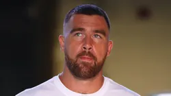 Travis Kelce walking into a stadium.