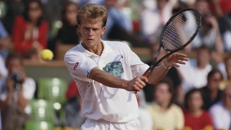 Stefan Edberg of Sweden makes a backhand volley.