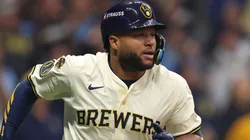 Jackson Chourio #11 of the Milwaukee Brewers rounds the bases after hitting a home run.