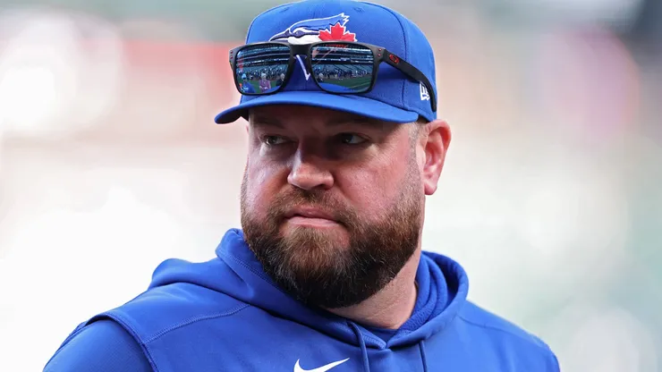John Schneider looks on before game 3 vs the Mariners on October 15, 2025 in Seattle.