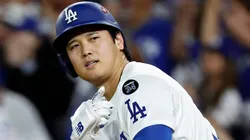 Shohei Ohtani #17 of the Los Angeles Dodgers reacts after hitting his third home run of the game.