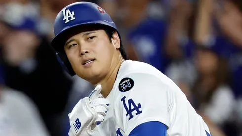 Shohei Ohtani #17 of the Los Angeles Dodgers reacts after hitting his third home run of the game.