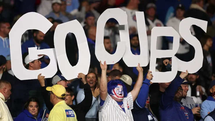Cubs fans hold a sign during game four of the National League Division Series in 2025.