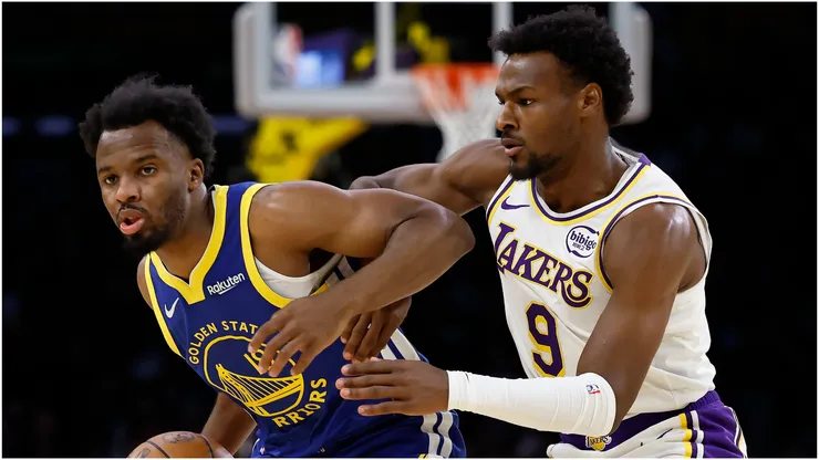 LJ Cryer of the Golden State Warriors controls the ball against Bronny James of the Los Angeles Lakers