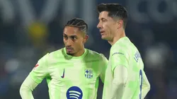Raphinha and Robert Lewandowski of FC Barcelona stand over a free-kick.
