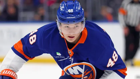 Matthew Schaefer #48 of the Islanders skates with the puck.