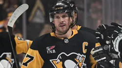 Sidney Crosby #87 of the Pittsburgh Penguins celebrates with teammates on the bench.
