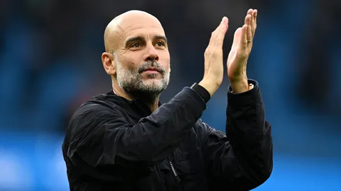 Pep Guardiola applauds the fans after a game.