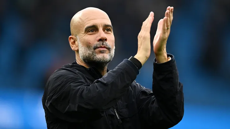 Pep Guardiola applauds the fans after a game.