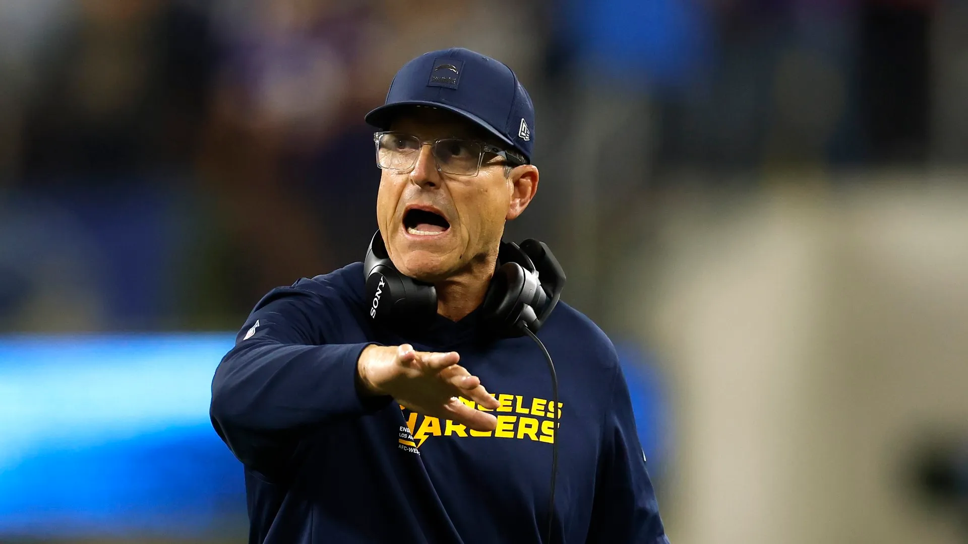 Jim Harbaugh celebrates a touchdown