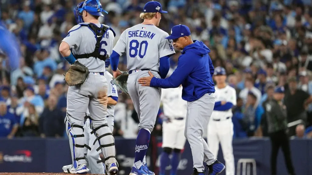 Emmet Sheehan #80 of the Dodgers walks to the dugout after a pitching change by manager Dave Roberts.  Mark Blinch/Getty Images