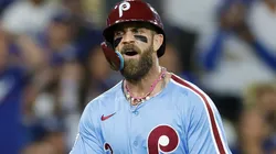 Bryce Harper #3 of the Philadelphia Phillies reacts as he scores.