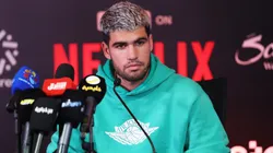 Carlos Alcaraz speaks during a press conference.