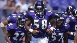 Peter Boulware #58 of the Baltimore Ravens jogs out onto the field during a game in 2000.