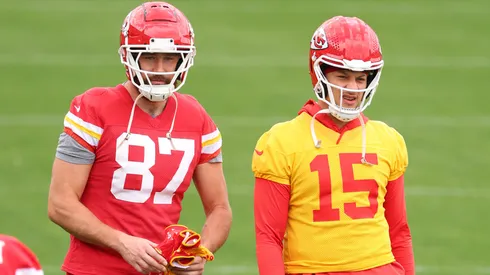 Patrick Mahomes #15 and Travis Kelce #87 of the Kansas City Chiefs warm up.