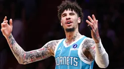 Charlotte Hornets' LaMelo Ball reacts during an NBA game against the Miami Heat.