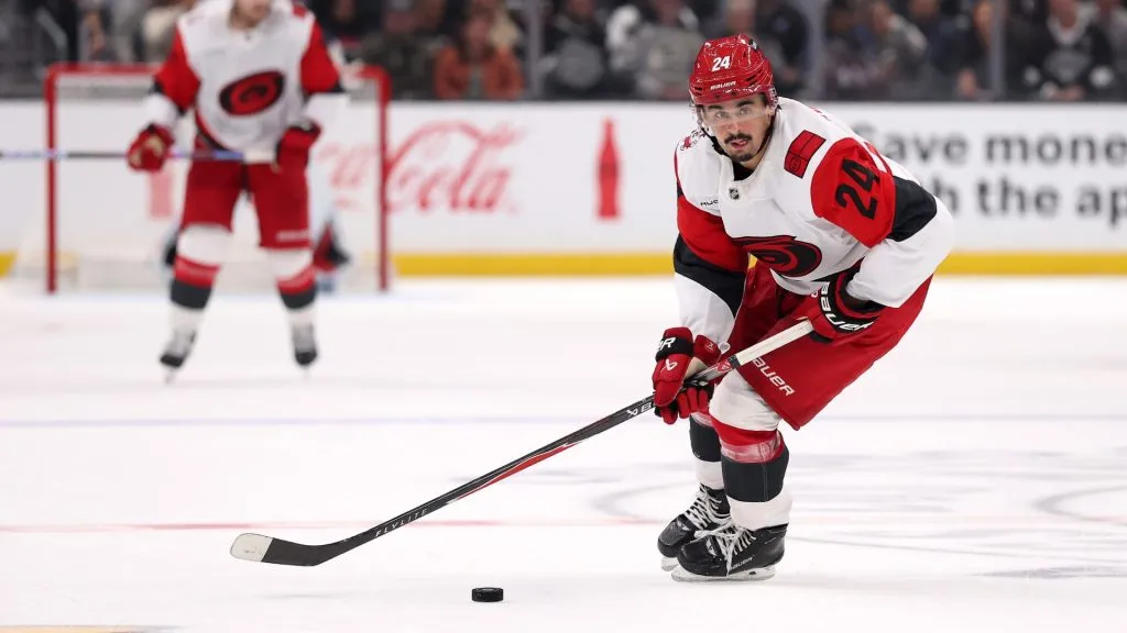 Seth Jarvis #24 of the Hurricanes skates with the puck. Luke Hales/Getty Images