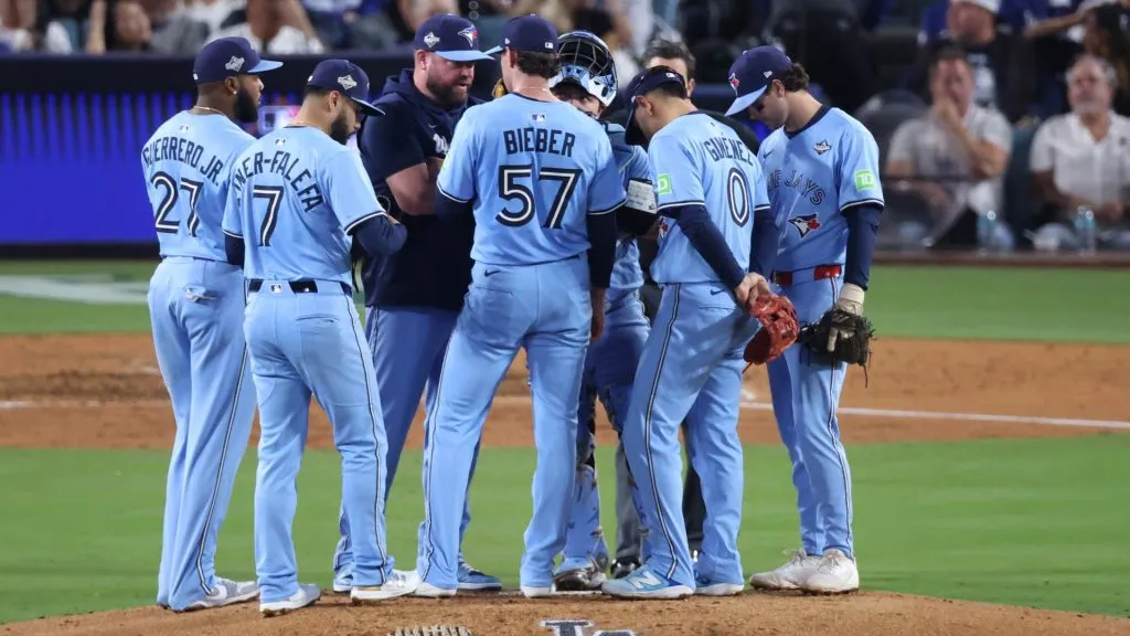 Manager John Schneider of the Blue Jays speaks with Shane Bieber #57 during a mound visit. Sean M. Haffey/Getty Images