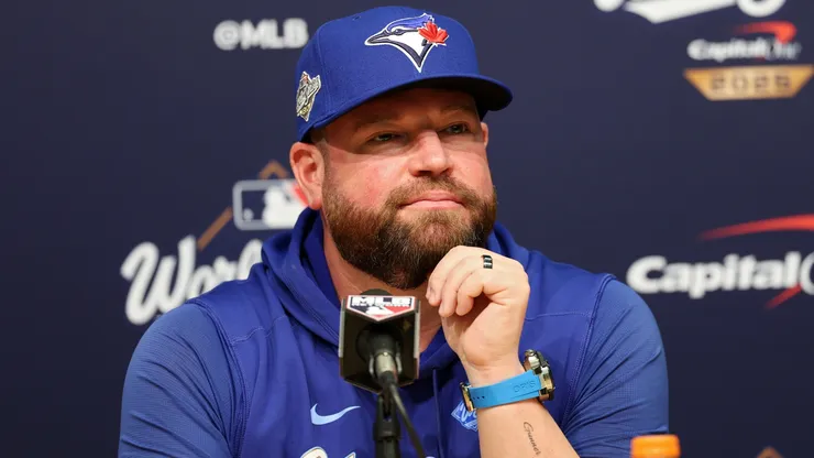 Manager John Schneider #14 of the Toronto Blue Jays speaks to the media.