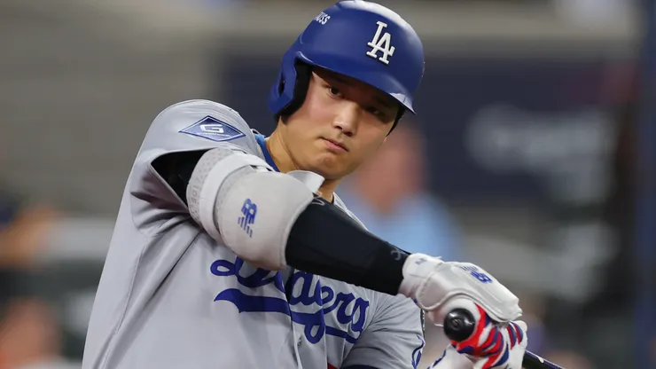 Shohei Ohtani #17 of the Los Angeles Dodgers warms up before an at-bat.