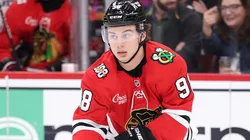 Connor Bedard #98 of the Chicago Blackhawks controls the puck.