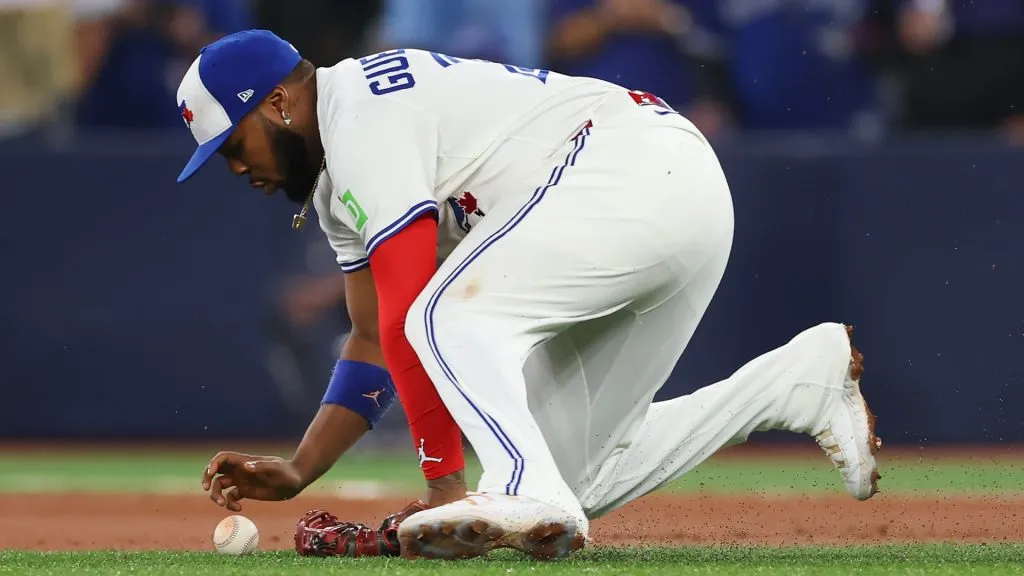 Vladimir Guerrero Jr. #27 of the Blue Jays dives for a ground ball against the Dodgers. Gregory Shamus/Getty Images