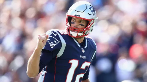 Tom Brady #12 of the New England Patriots celebrates after throwing a touchdown pass in 2018.