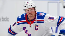 J.T. Miller #8 of the New York Rangers stretches prior to NHL action.