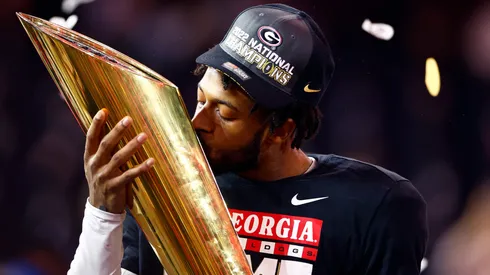 Javon Bullard #22 of the Georgia Bulldogs kisses the College Football Playoff National Championship Trophy.