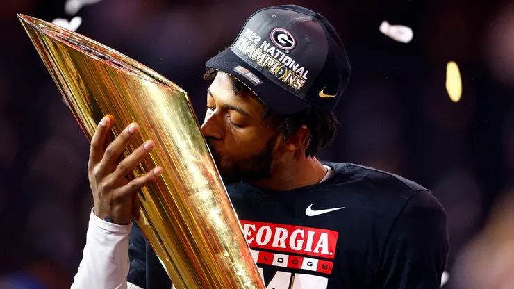 Javon Bullard #22 of the Georgia Bulldogs kisses the College Football Playoff National Championship Trophy.