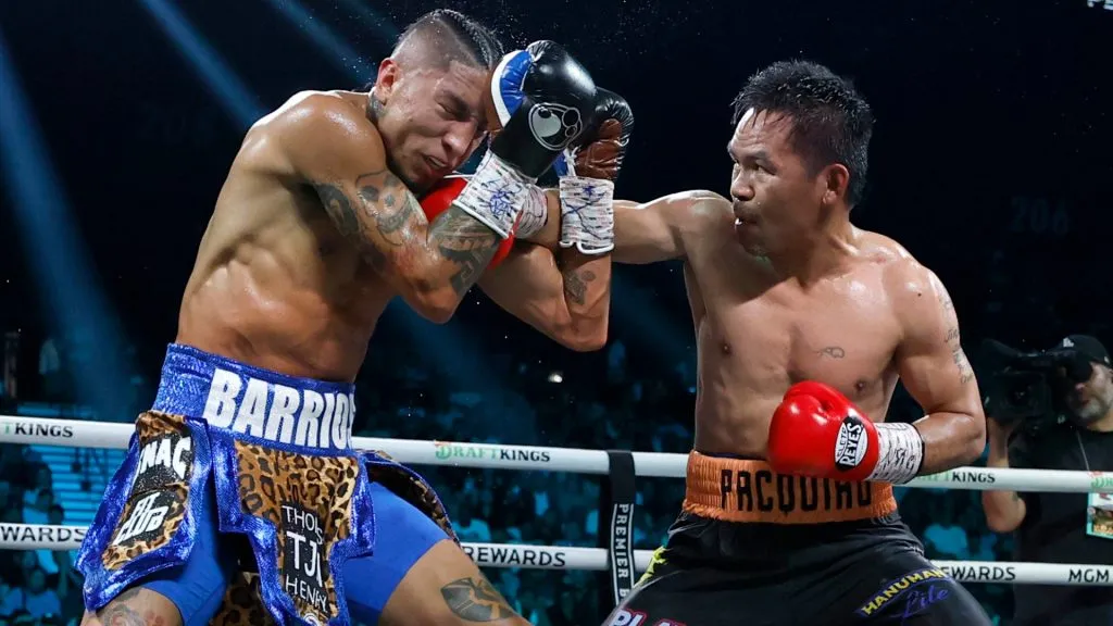 Manny Pacquiao (R) punches Mario Barrios during their WBC welterweight title fight. Harry How/Getty Images