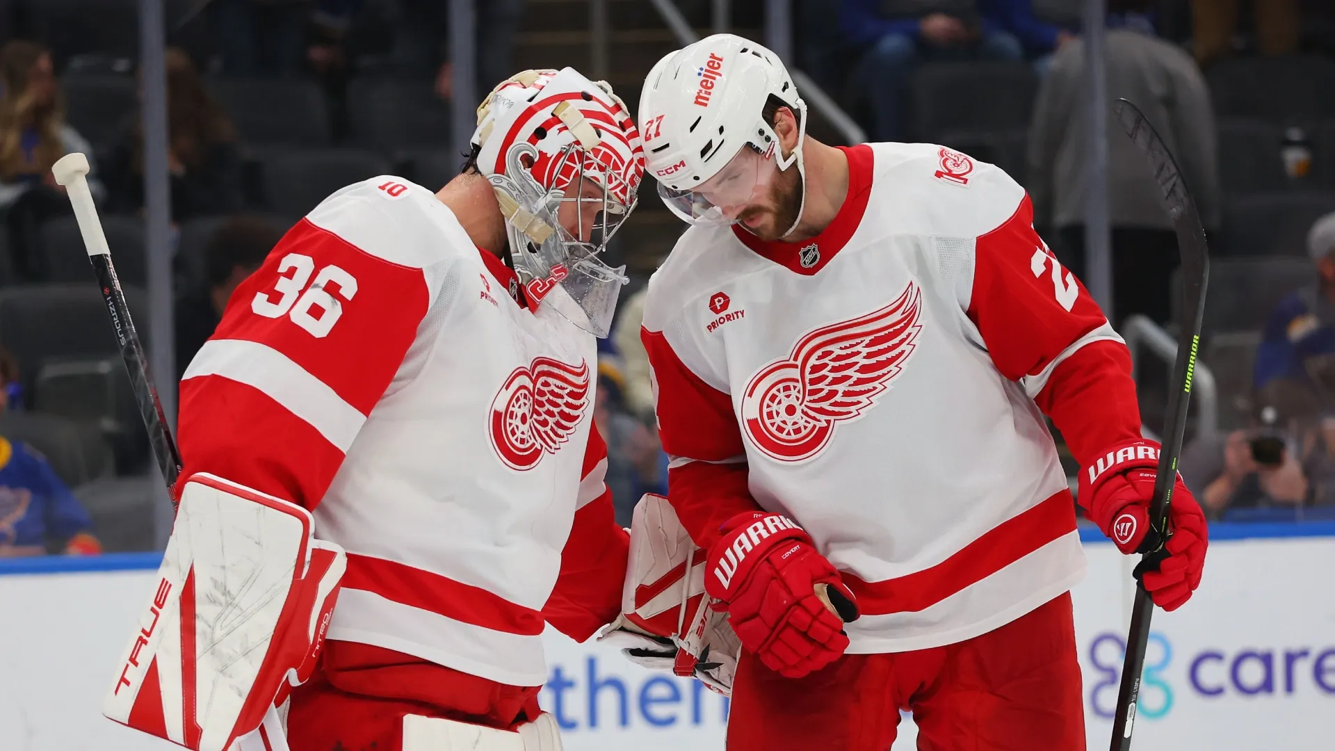 John Gibson #36 and Michael Rasmussen #27 both of the Red Wings celebrate after beating the Blues. Dilip Vishwanat/Getty Images
