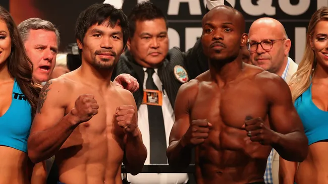 Manny Pacquiao and Timothy Bradley Jr. pose during their official weigh-in. Christian Petersen/Getty Images