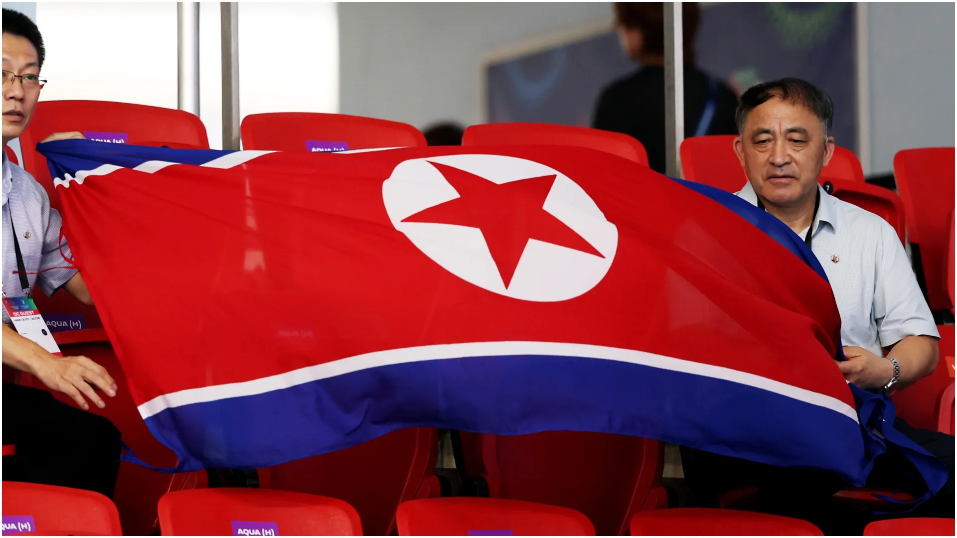 Supporters display a North Korean national flag – Lintao Zhang/Getty Images