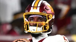 Jayden Daniels #5 of the Washington Commanders warms up.