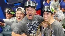 Shohei Ohtani #17, Yoshinobu Yamamoto #18, and Roki Sasaki #11 of the Los Angeles Dodgers celebrate.